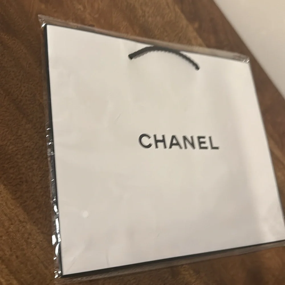 Authentic CHANEL gift bag. 10.5 x 9 x 4.5 in. White with logo in black